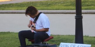 Jasper Lee ‘feels for people’ and his guitar strumming raises money for Stop AAPI Hate jasper plays guitar